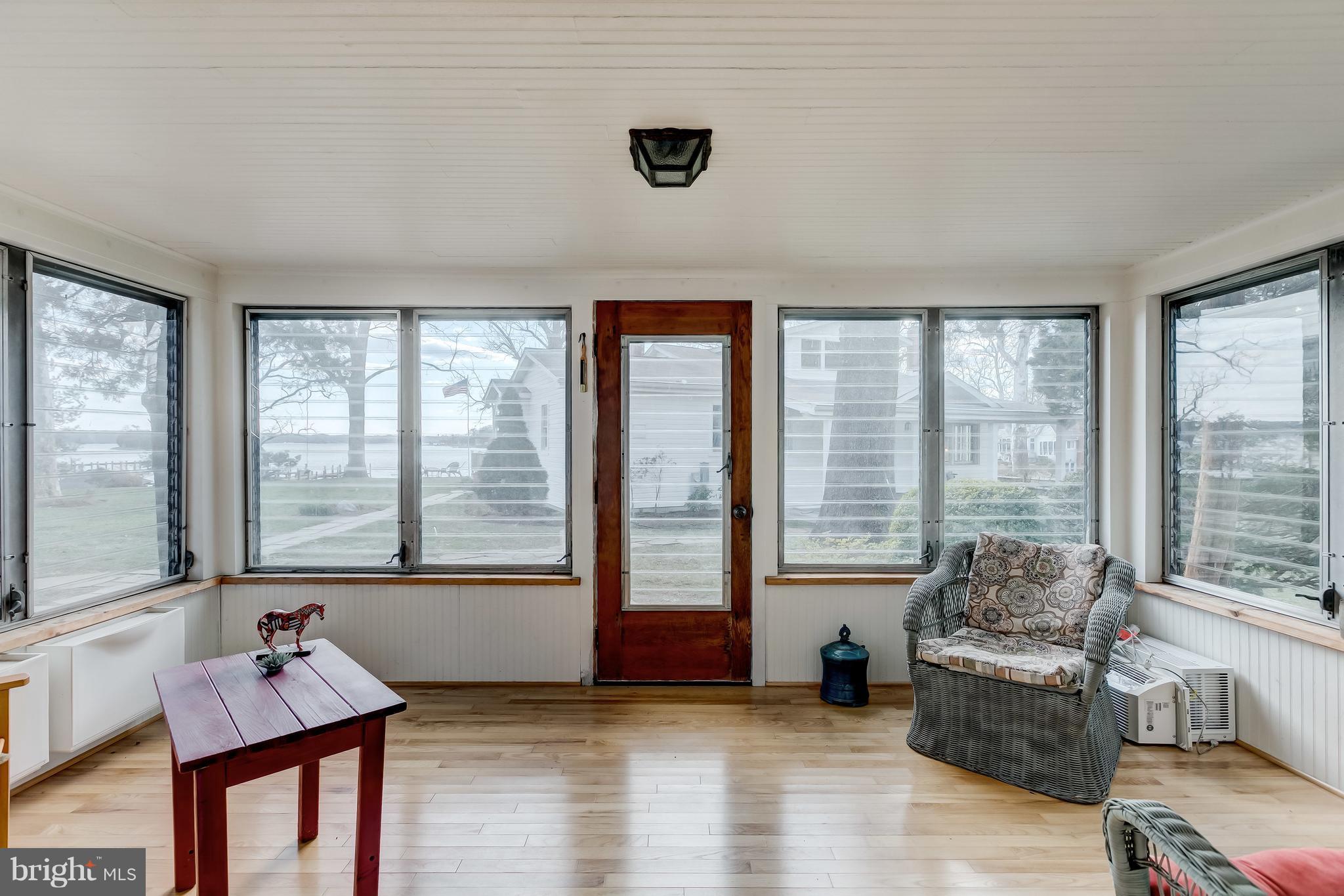 352 Hickory Point Road Pasadena, MD 21122 - Photo 27 of 28 Enclosed porch with water views