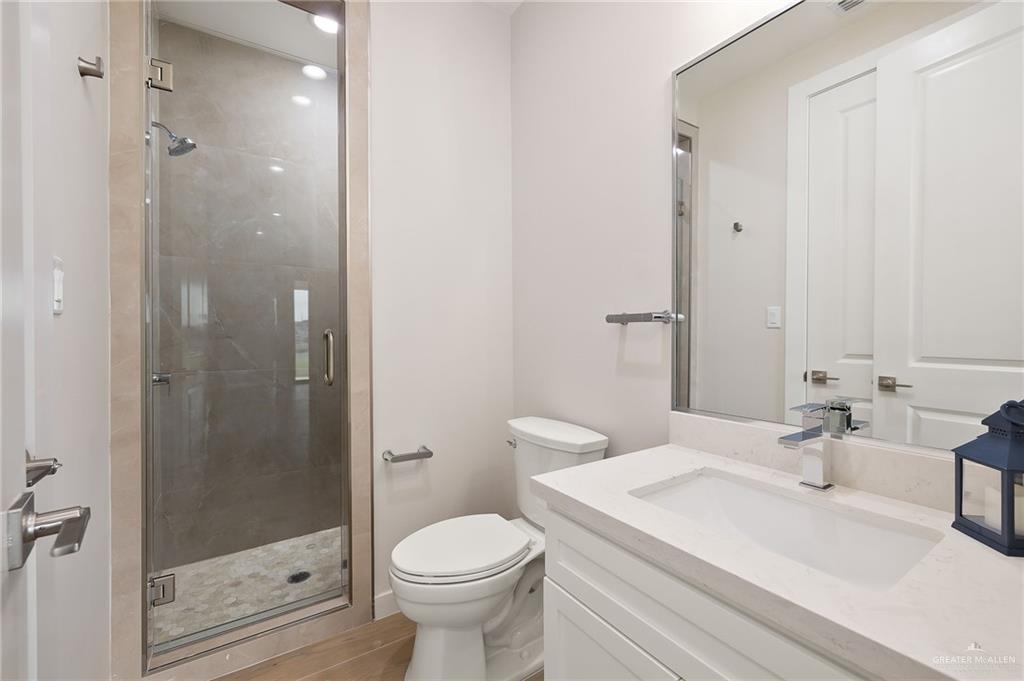 2529 Trinity Avenue McAllen, TX 78504 - Photo 13 of 25 a bathroom with a sink a toilet and shower