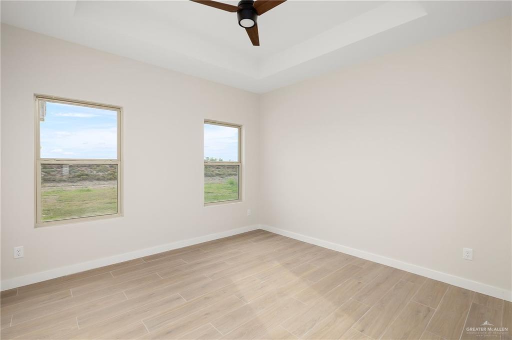 2529 Trinity Avenue McAllen, TX 78504 - Photo 16 of 25 an empty room with windows
