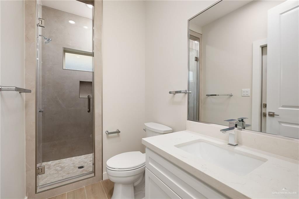 2529 Trinity Avenue McAllen, TX 78504 - Photo 17 of 25 a bathroom with a sink a toilet and shower