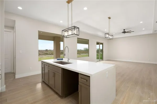 a kitchen with a sink and a stove