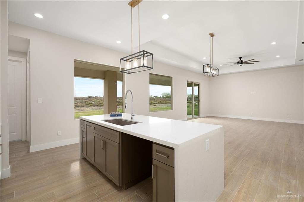 2529 Trinity Avenue McAllen, TX 78504 - Photo 6 of 25 a kitchen with a sink and a stove