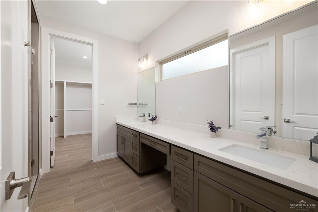 2529 Trinity Avenue McAllen, TX 78504 - Photo 10 of 25 a bathroom with a double vanity sink mirror and double