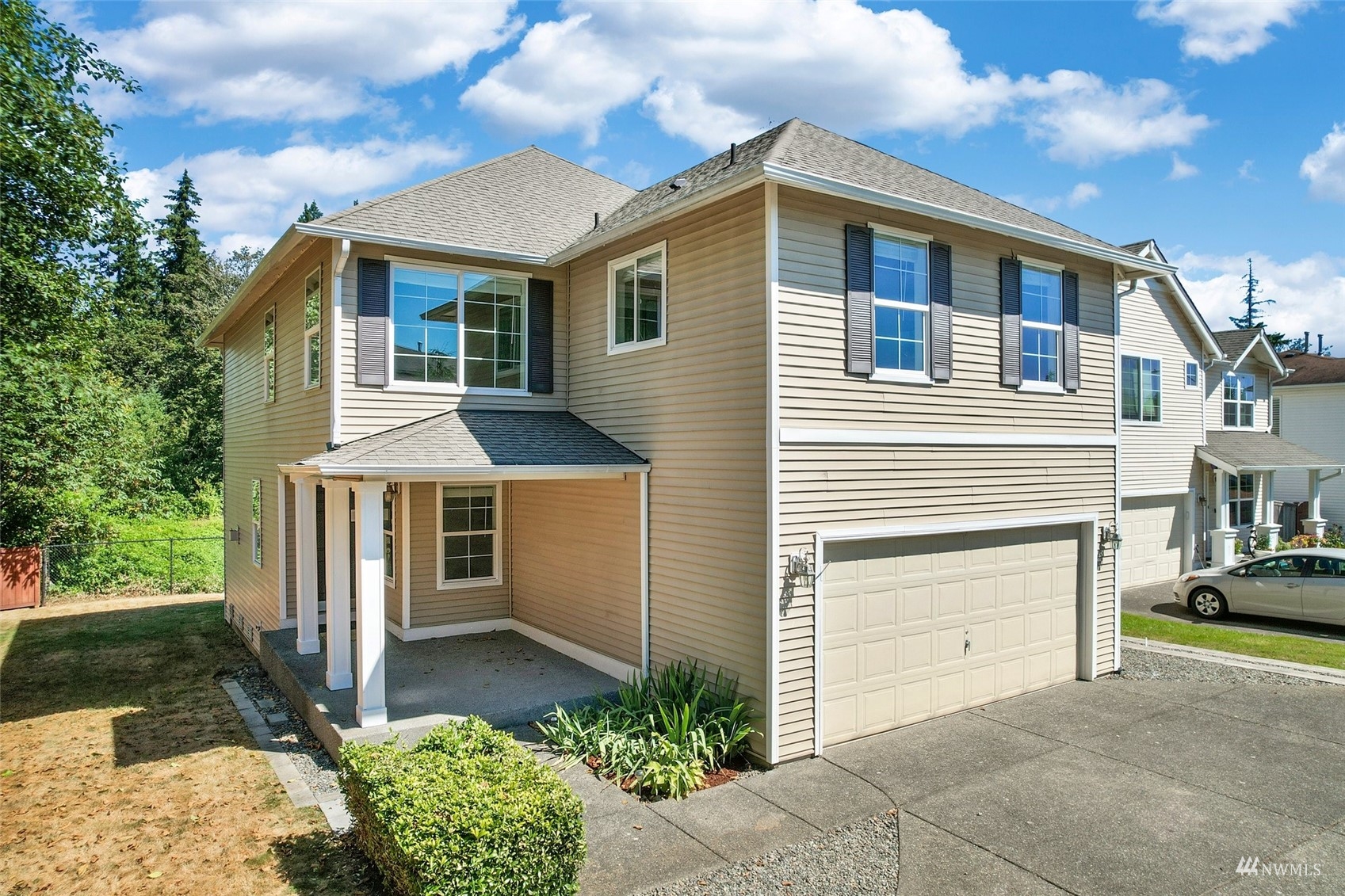 18015 168th Way Southeast Renton, WA 98058 - Photo 1 of 40 a front view of a house with a yard and garage