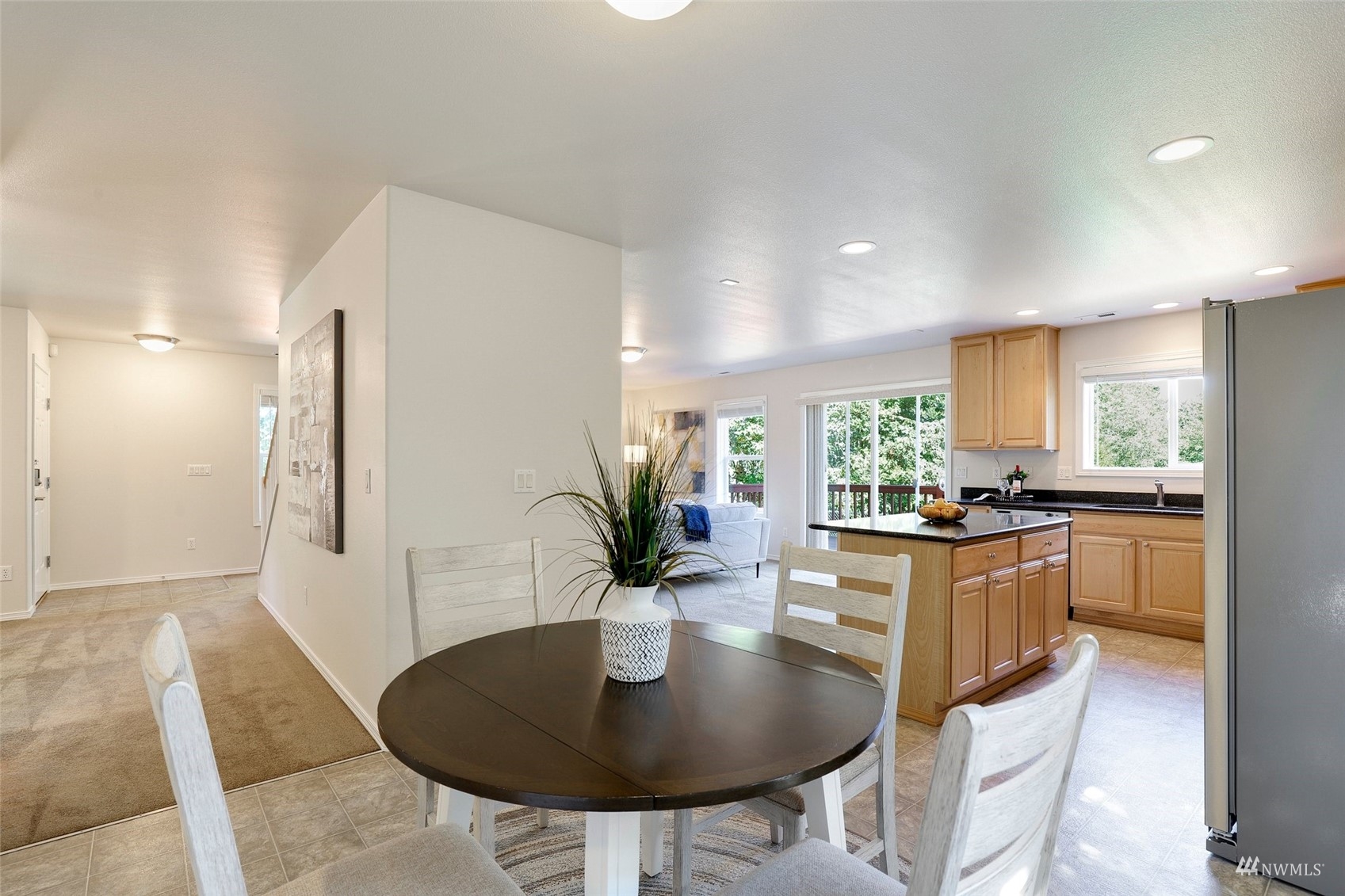 18015 168th Way Southeast Renton, WA 98058 - Photo 14 of 40 a kitchen with stainless steel appliances granite countertop kitchen island wooden cabinets and dining table