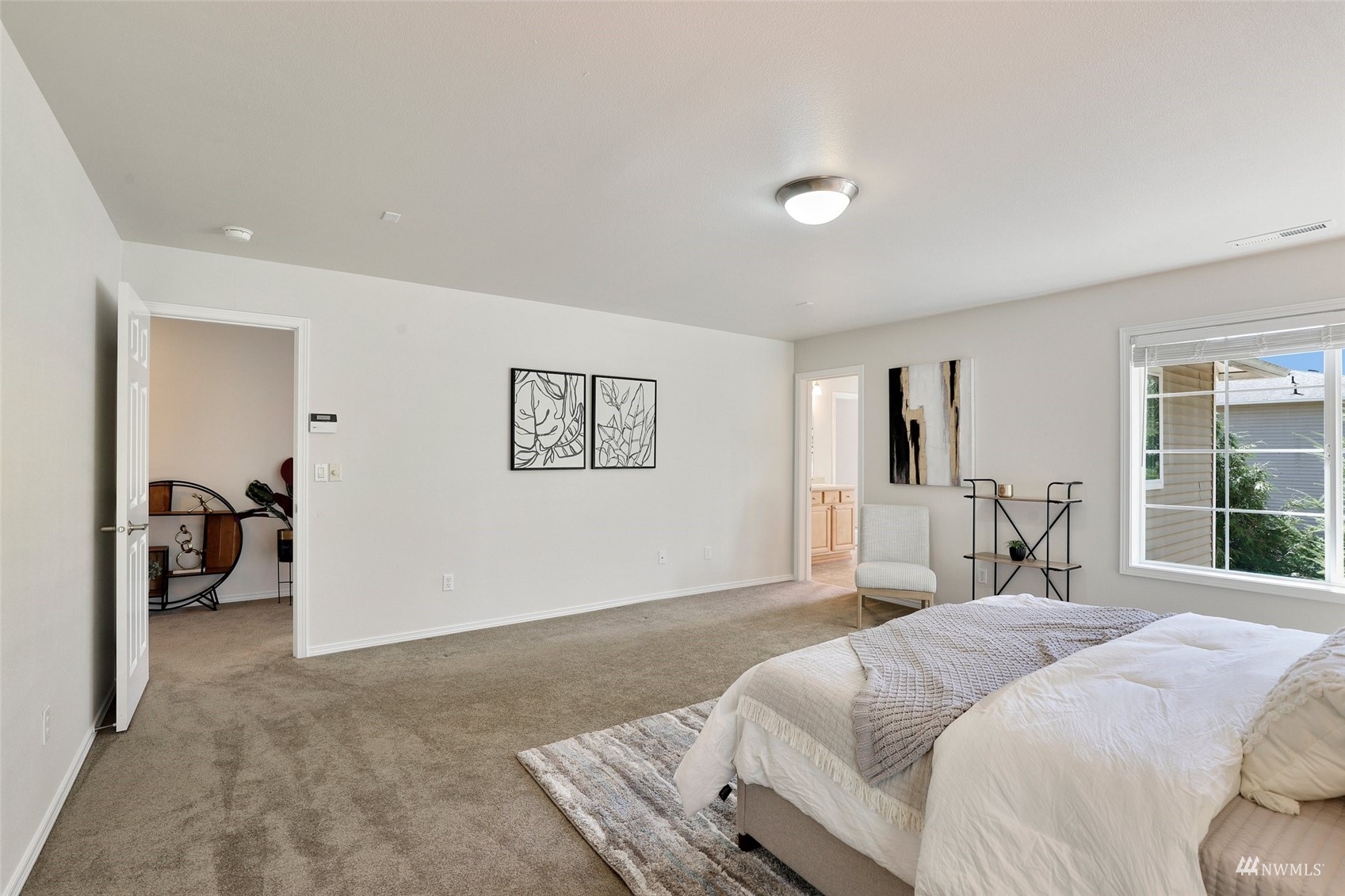 18015 168th Way Southeast Renton, WA 98058 - Photo 20 of 40 a bedroom with a bed and a large mirror