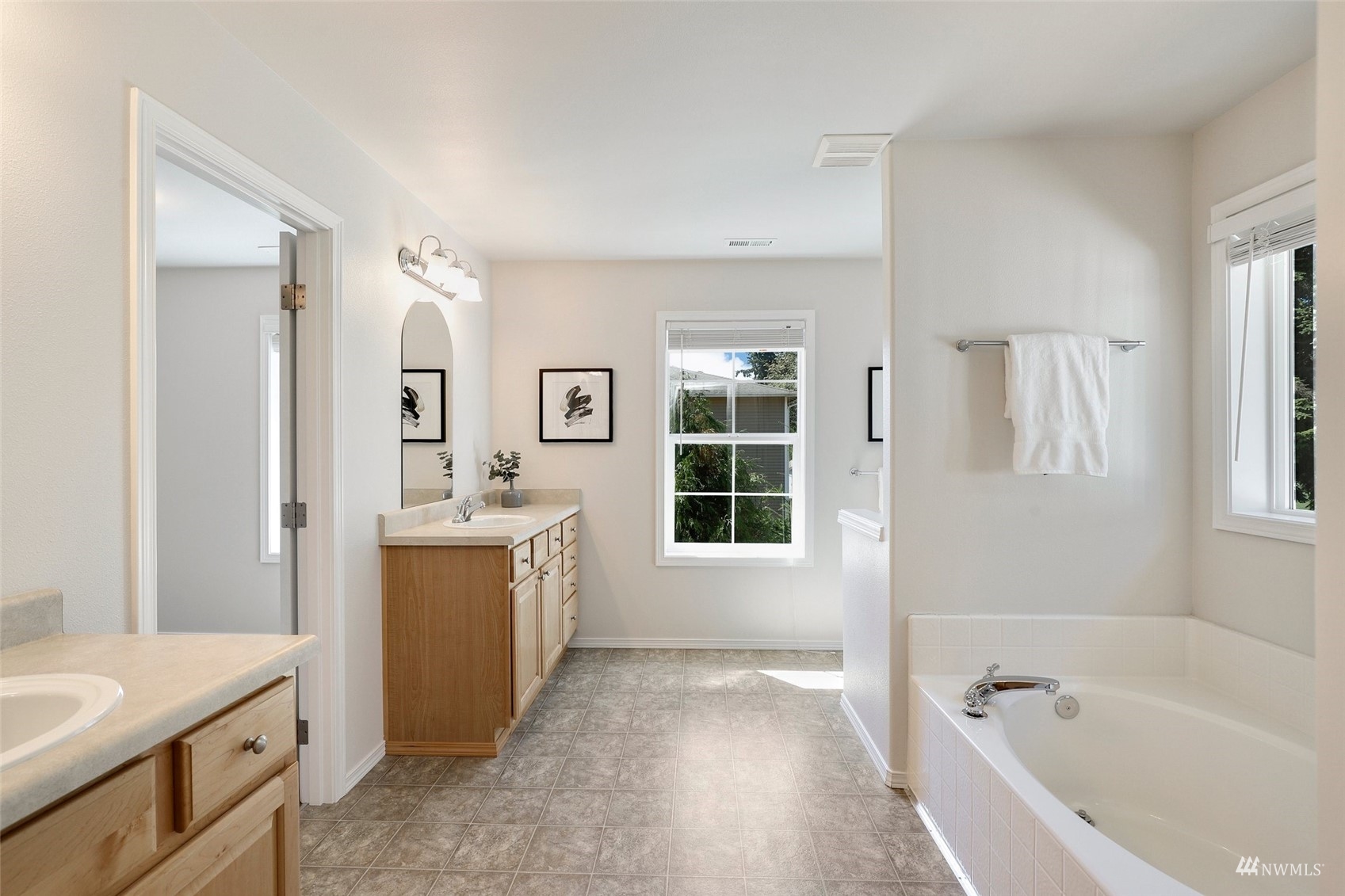 18015 168th Way Southeast Renton, WA 98058 - Photo 21 of 40 a bathroom with a tub sink and mirror