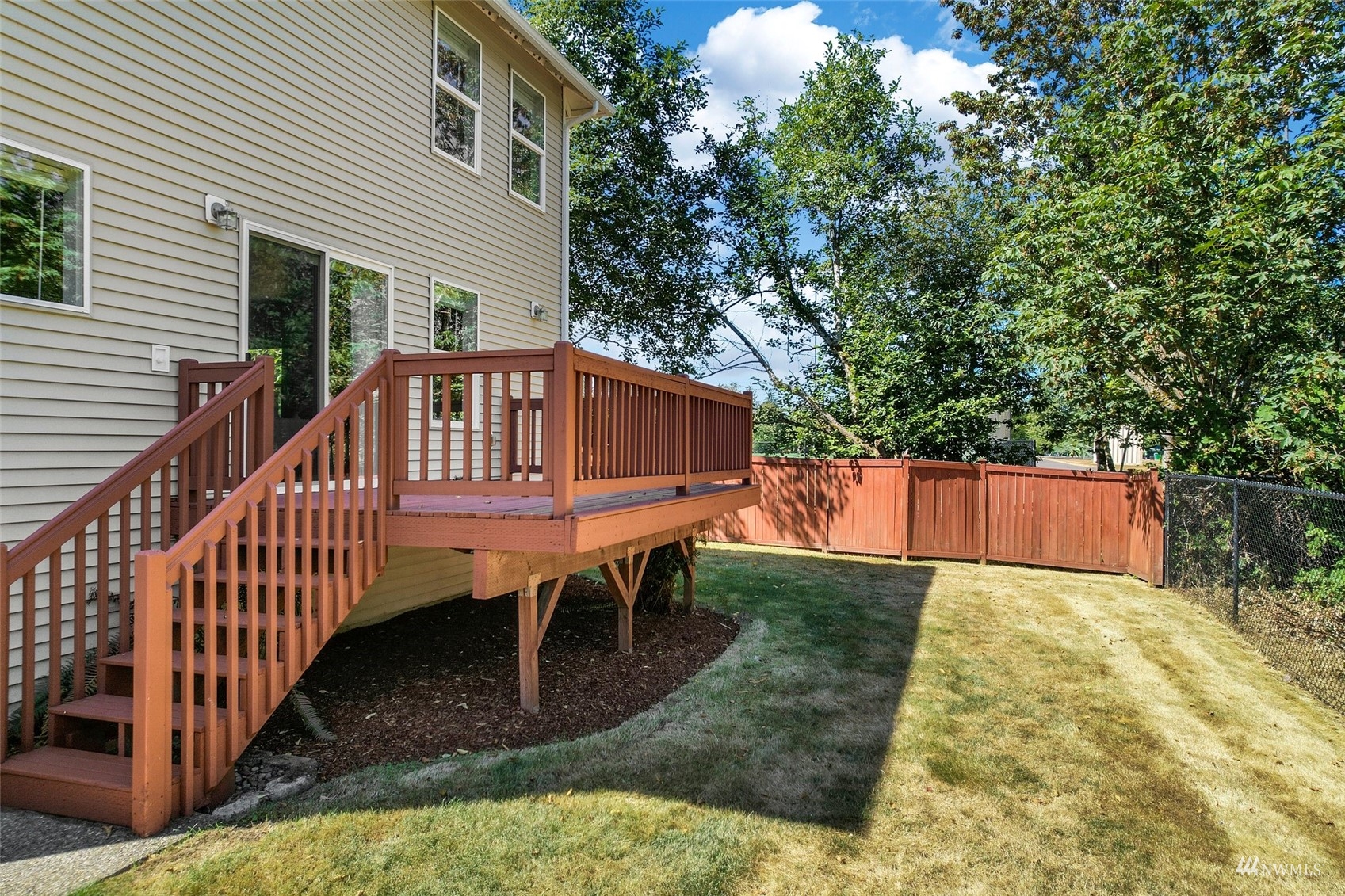 18015 168th Way Southeast Renton, WA 98058 - Photo 31 of 40 a view of a house with backyard and deck