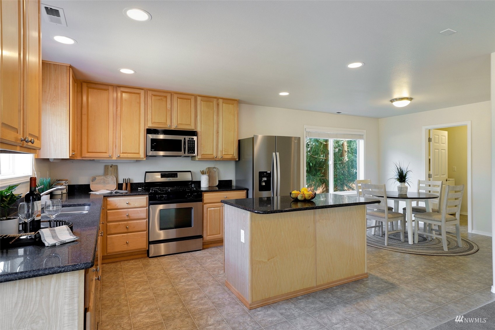 18015 168th Way Southeast Renton, WA 98058 - Photo 9 of 40 a kitchen with microwave a stove and cabinets