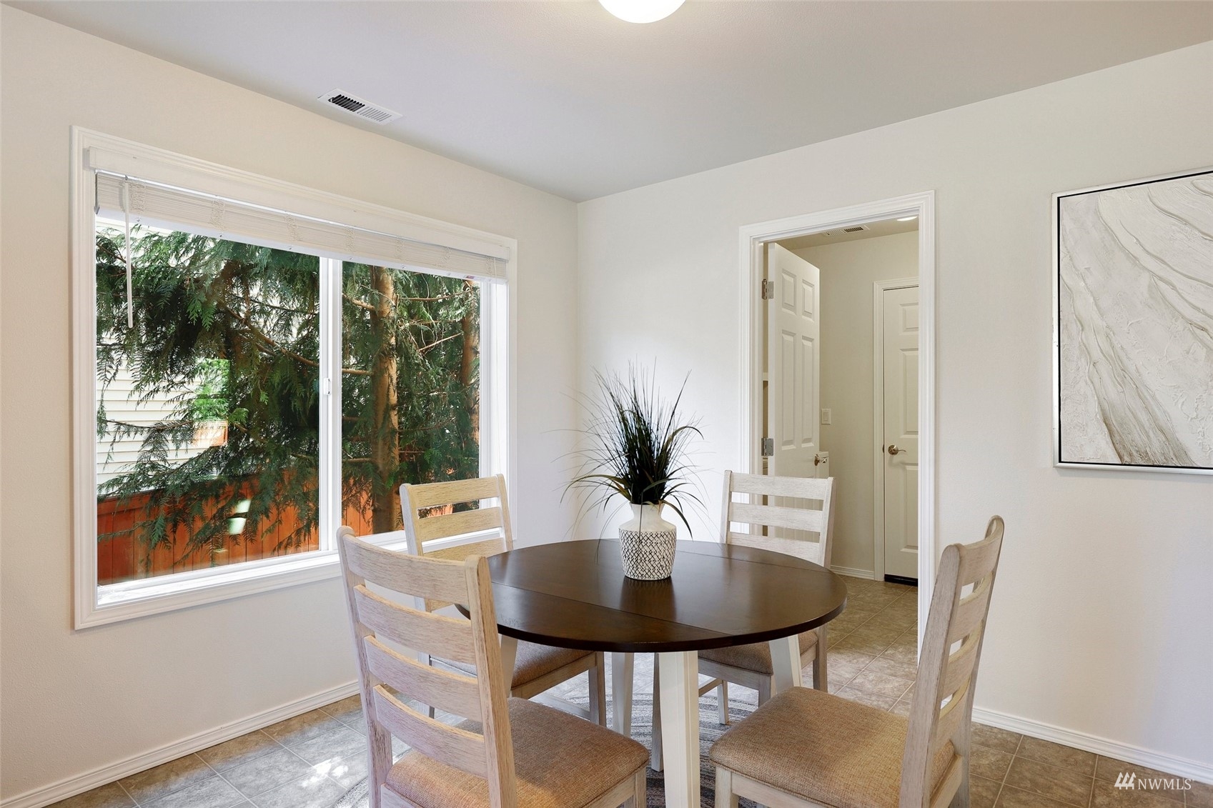 18015 168th Way Southeast Renton, WA 98058 - Photo 10 of 40 a view of a dining room with furniture and wooden floor