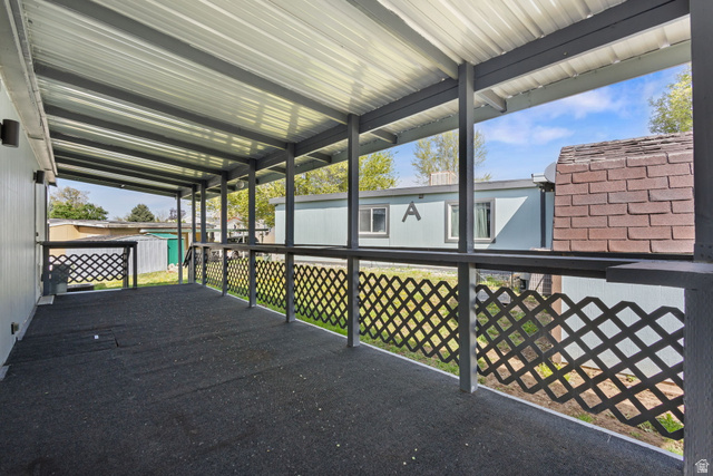 2600 North Hill Field Road, Unit 86 Layton, UT 84041 - Photo 22 of 25 View of patio featuring a storage shed