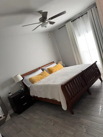 a bed sitting in a room next to a window