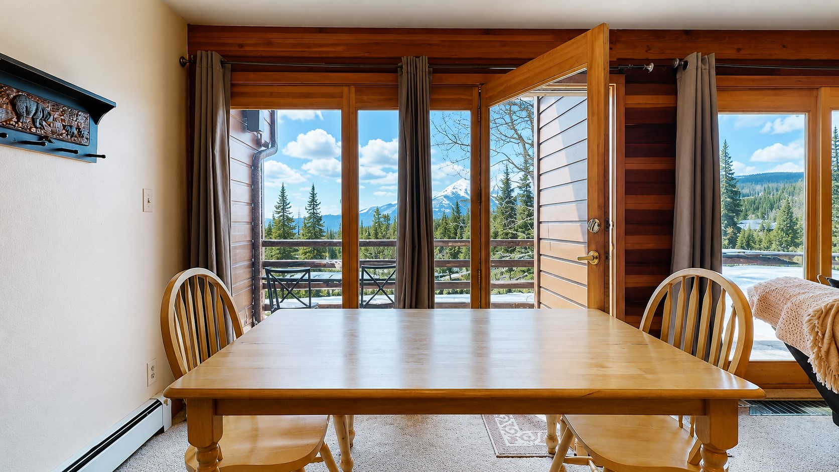91200 Ryan Gulch Road, Unit 213 Silverthorne, CO 80498 - Photo 3 of 33 a view of a dining room with furniture and window