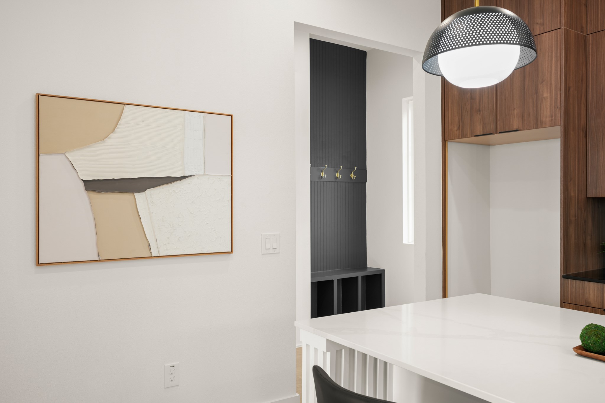 601 Vermont Road, Unit 2 Austin, TX 78702 - Photo 11 of 31 A well-lit kitchen featuring rich wood cabinetry and a functional entryway mudroom nook.