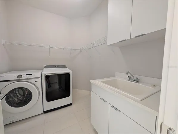 a view of an empty room with a floor to ceiling window and stairs