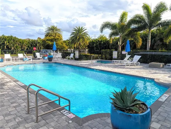 a view of a swimming pool with a patio