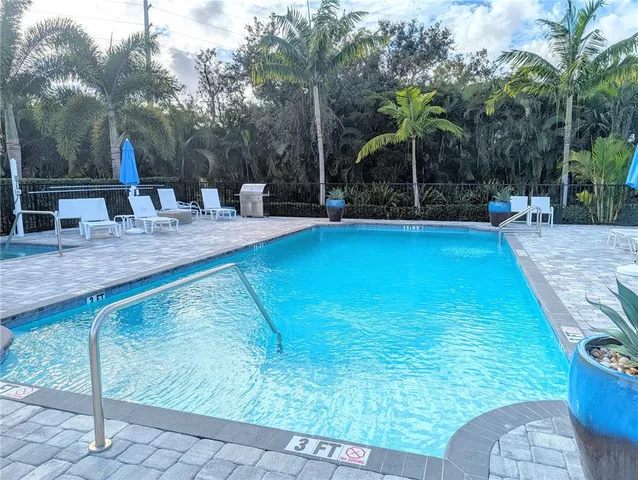 a view of a two chairs in the patio