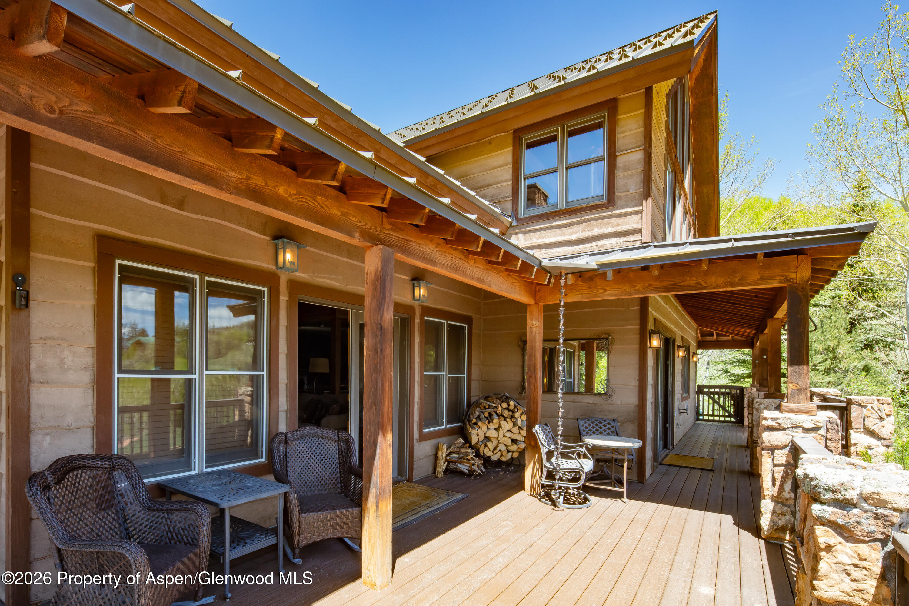 294 Ruedi Creek Road Basalt, CO 81621 - Photo 3 of 27 a view of a balcony with chair and tables
