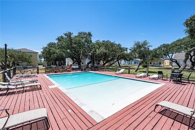 a view of swimming pool with seating area