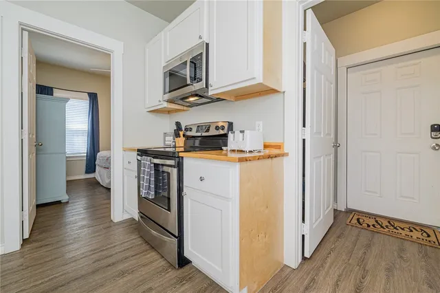a kitchen with stainless steel appliances granite countertop a stove and a refrigerator