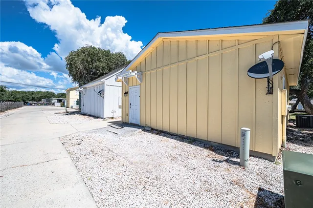 a view of a backyard with pathway