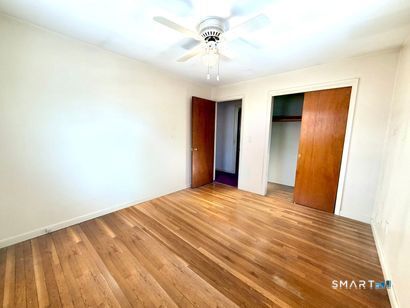 282 Horace Street Bridgeport, CT 06610 - Photo 13 of 16 a view of empty room with wooden floor