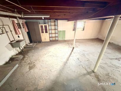 282 Horace Street Bridgeport, CT 06610 - Photo 15 of 16 a view of a room with wooden walls