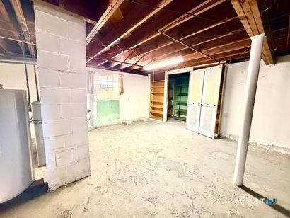 282 Horace Street Bridgeport, CT 06610 - Photo 16 of 16 a view of a room with wooden walls and windows