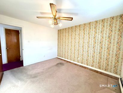282 Horace Street Bridgeport, CT 06610 - Photo 10 of 16 a view of a big room with carpet