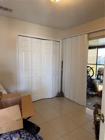 a view of a livingroom with furniture and a window