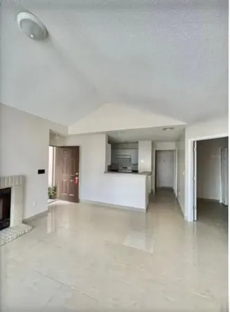 a kitchen with a cabinets and white appliances