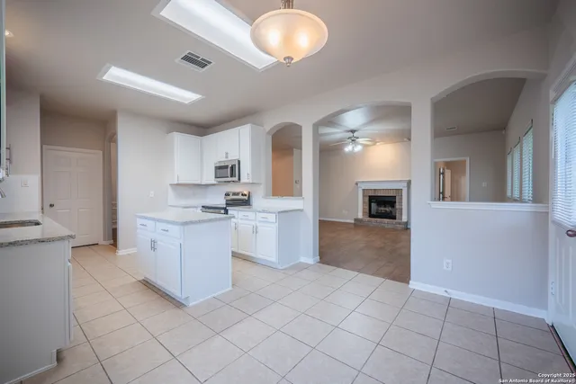 a kitchen with a sink and cabinets