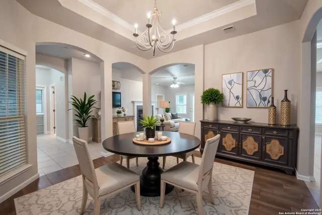 a view of a dining room with furniture and wooden floor