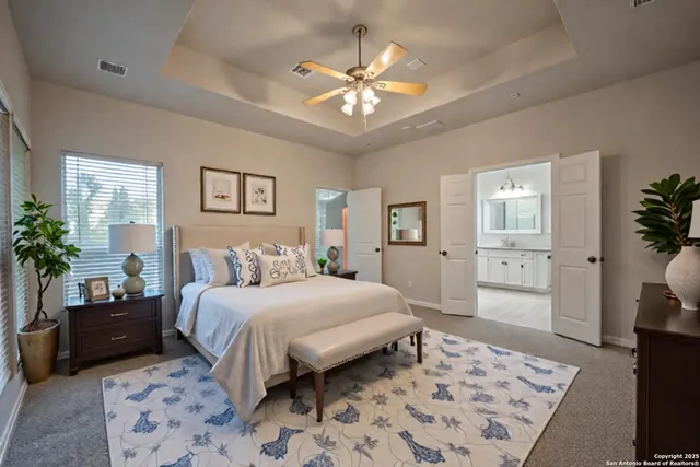 a bedroom with a large bed and a couch