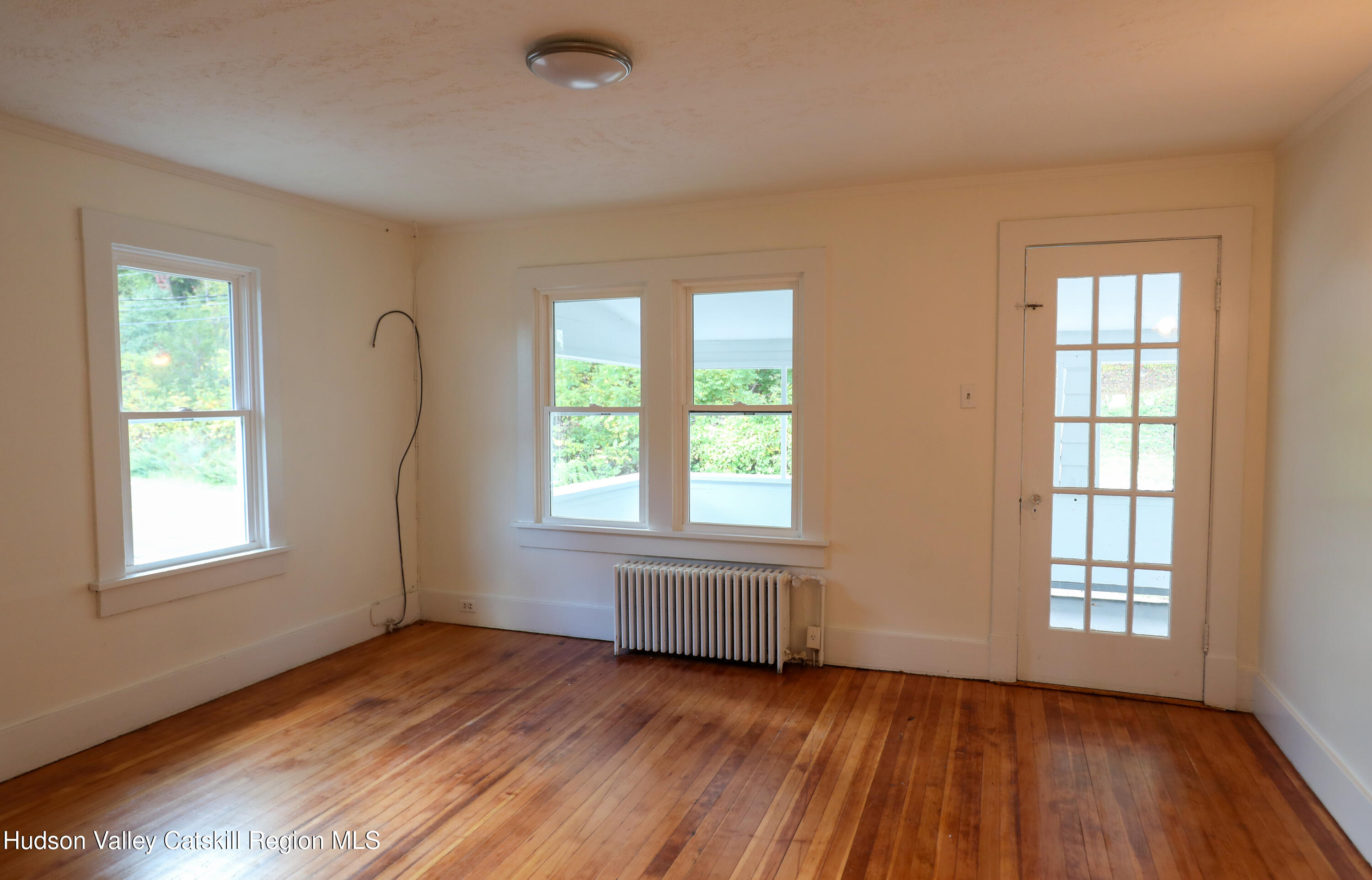 4294 Rte 9W, Unit 1 West Camp, NY 12490 - Photo 13 of 21 an empty room with wooden floor and windows