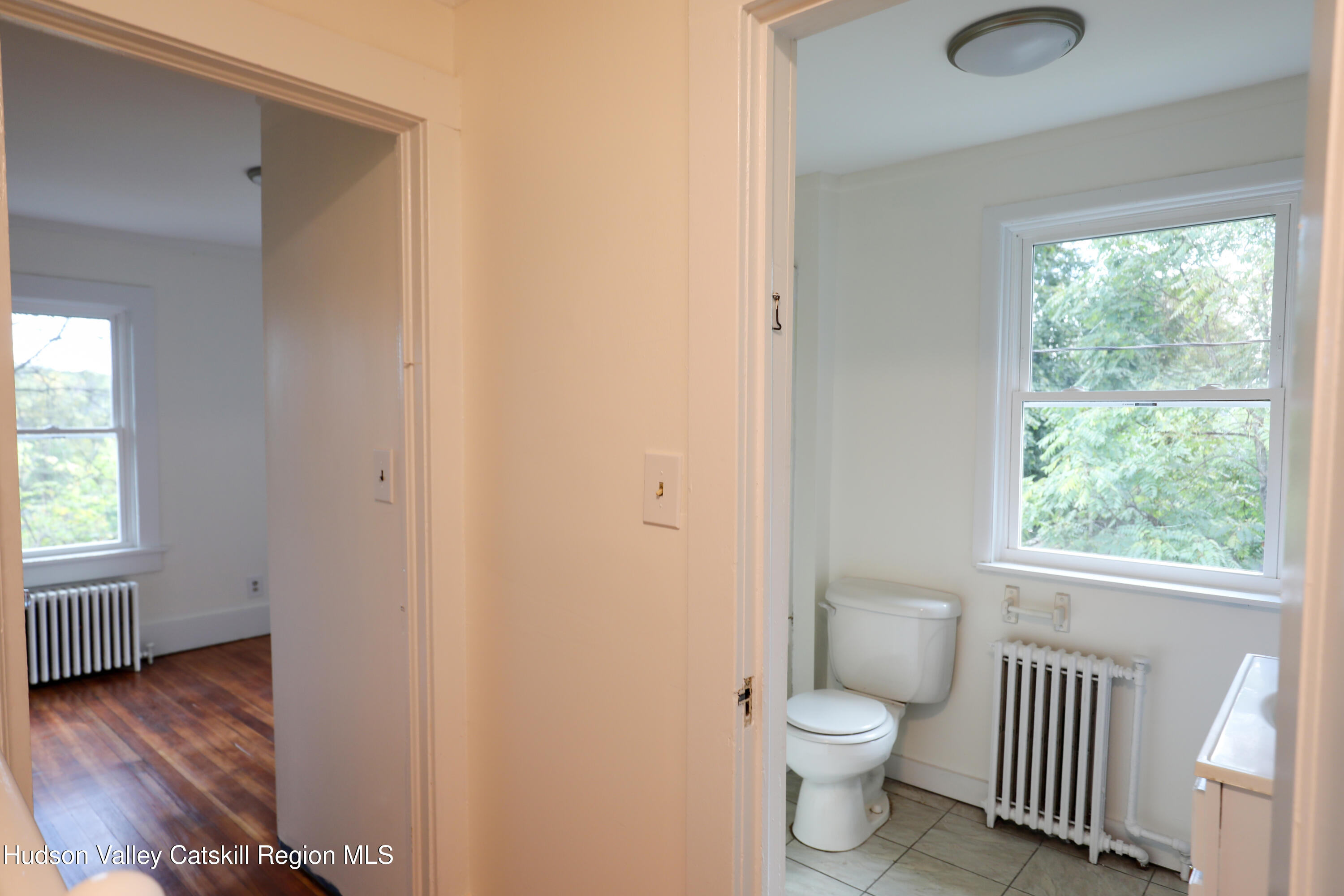 4294 Rte 9W, Unit 1 West Camp, NY 12490 - Photo 10 of 21 a bathroom with a toilet sink and a window