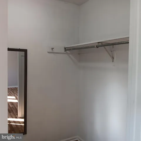 a view of an empty walk in closet