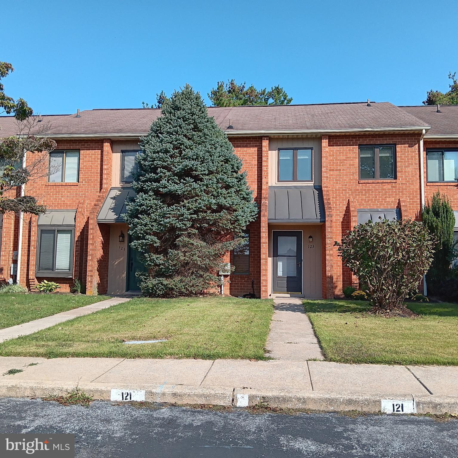 123 Caernarvon Court Exton, PA 19341 - Photo 2 of 43 a front view of a house with a garden