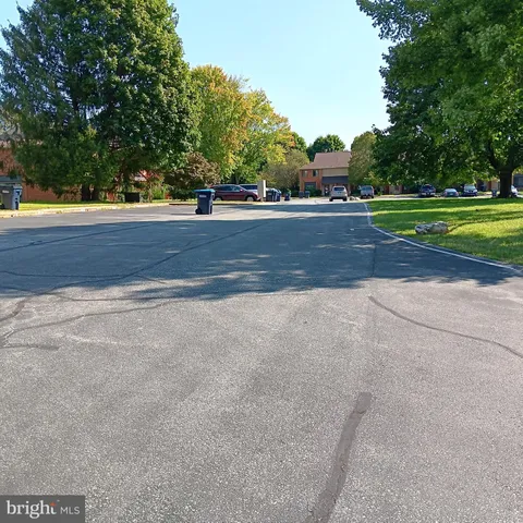 a view of a swimming pool and a yard