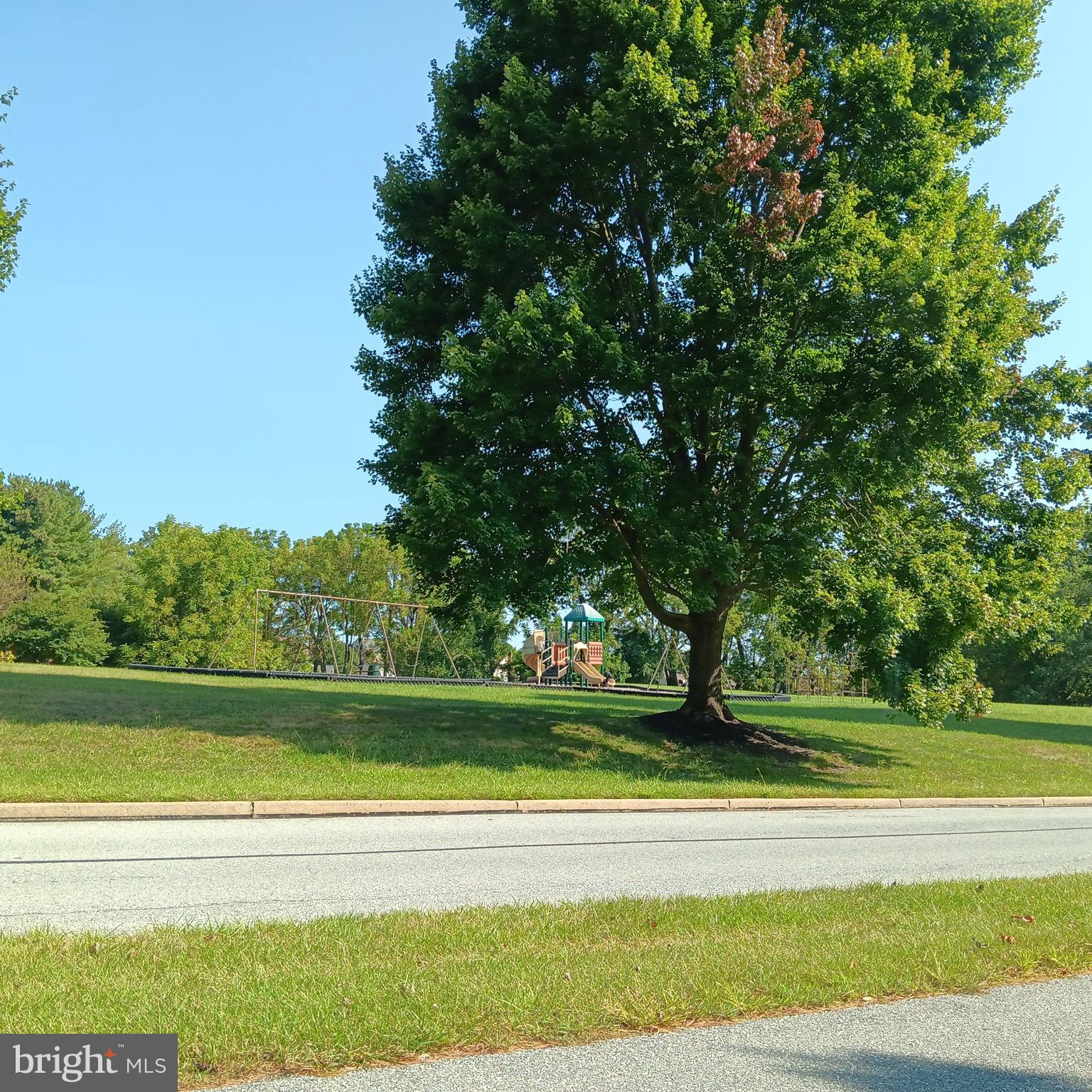 123 Caernarvon Court Exton, PA 19341 - Photo 39 of 43 a view of a swimming pool and a yard