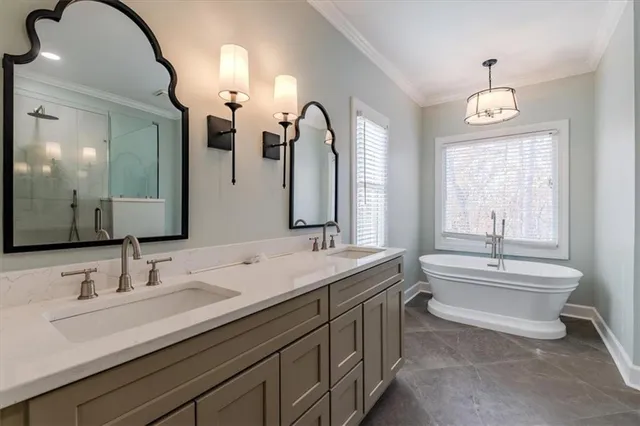 a bathroom with a double vanity sink and a mirror