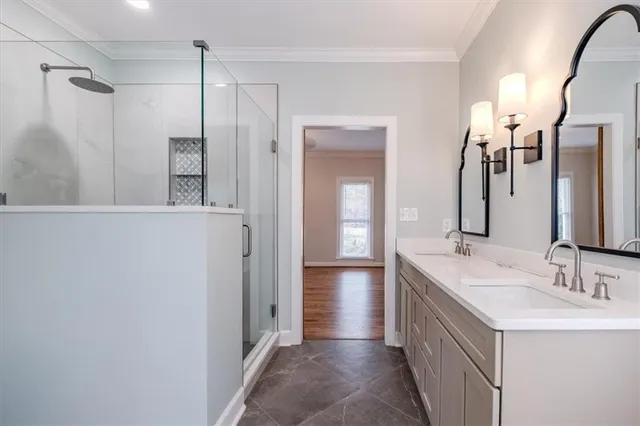 a bathroom with a double vanity sink and a mirror