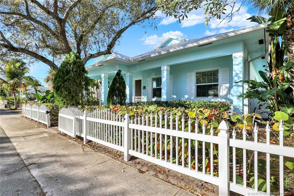 424 Southwest Camden Avenue Stuart, FL 34994 - Photo 2 of 58 a view of a house with a small yard