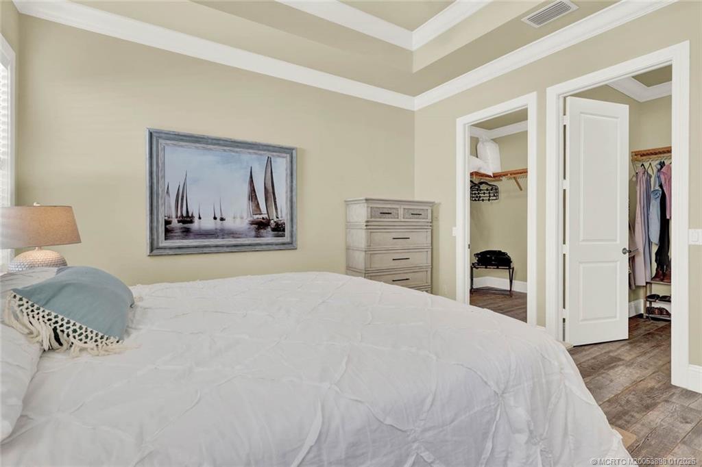 424 Southwest Camden Avenue Stuart, FL 34994 - Photo 30 of 58 a bedroom with a bed and a couch