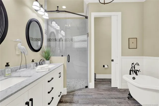 a white bath tub sitting next to a white sink