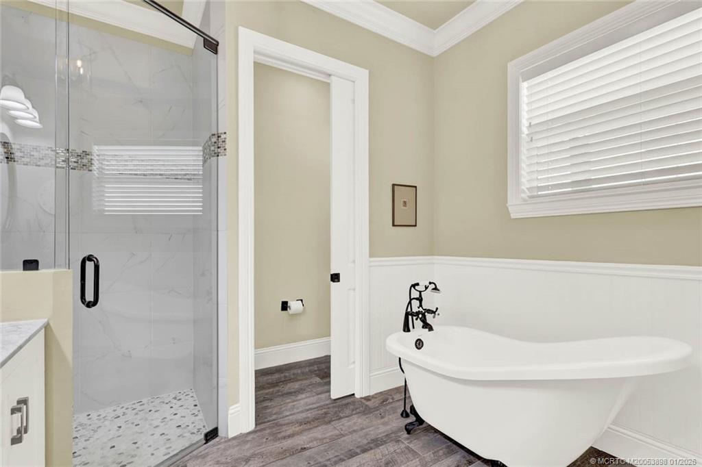 424 Southwest Camden Avenue Stuart, FL 34994 - Photo 33 of 58 a white bath tub sitting next to a white sink