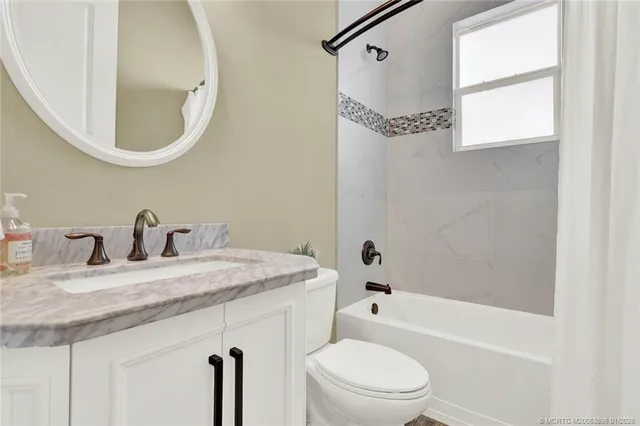 a large bed sitting in a bedroom next to a cabinet