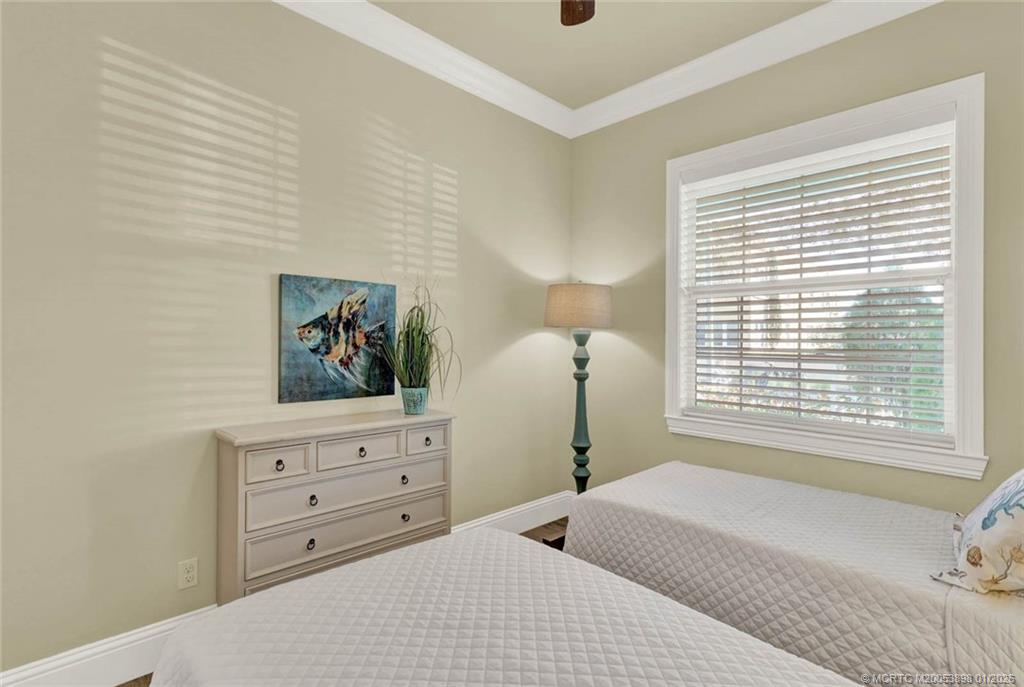 424 Southwest Camden Avenue Stuart, FL 34994 - Photo 39 of 58 a bedroom with a bed and a window