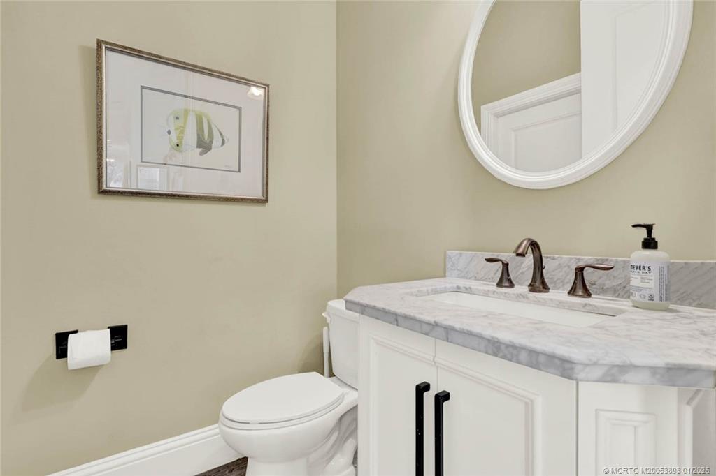 424 Southwest Camden Avenue Stuart, FL 34994 - Photo 40 of 58 a bathroom with a toilet and a sink