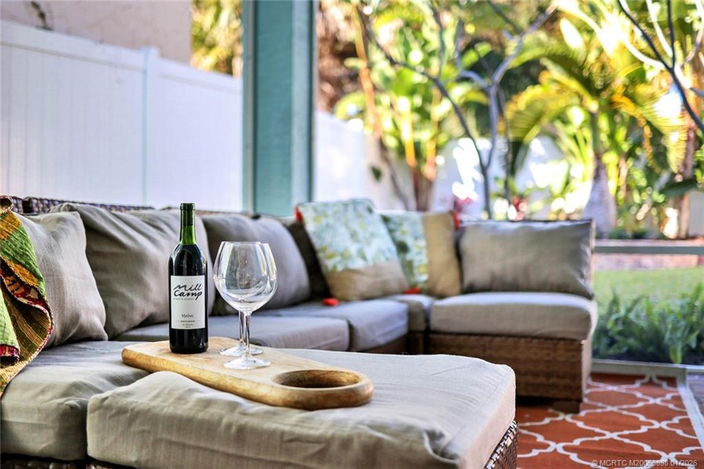 424 Southwest Camden Avenue Stuart, FL 34994 - Photo 46 of 58 a living room with furniture and a potted plant